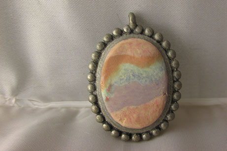 Swirled layers of stone-like 'Granitex' clay set into a bezel.